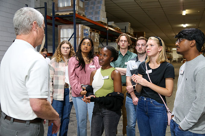 PROPEL Rural Scholars meet with David Douglas, owner of Matrix Cabinets in Baxley, Georgia, as part of a tour of Appling County. Scholars, left to right, include Alyssa Ashurst, Shraddha Bandlamudi, Linet Namuli, Max White, Chase Reece, Hannah Willerson, Shreyas Kumar.