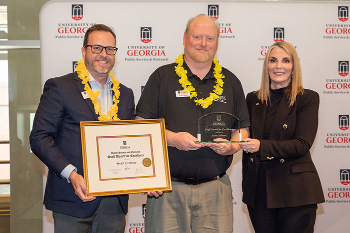 Scott Crabtree (center), received the PSO Staff Award for Excellence at the PSO Fall Appreciation Event. Pictured with Institute of Government Director Rob Gordon (left) and Vice President for Public Service and Outreach Jennifer Frum (right).