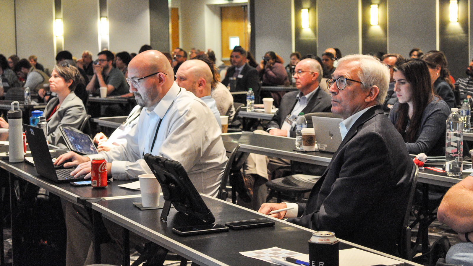 People listen to a presentation at the 2023 Developing Data Analytics Capabilities Conference. The 2024 conference, presented by the UGA Institute of Government Georgia Data Innovation Hub, will focus on how generative artificial intelligence and advanced analytics will affect governments.