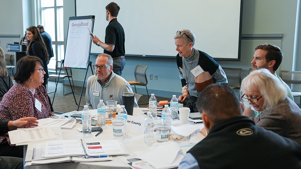 Marion County PROPEL Steering Committee members engaged in conversation at a January workshop at the University of Georgia.