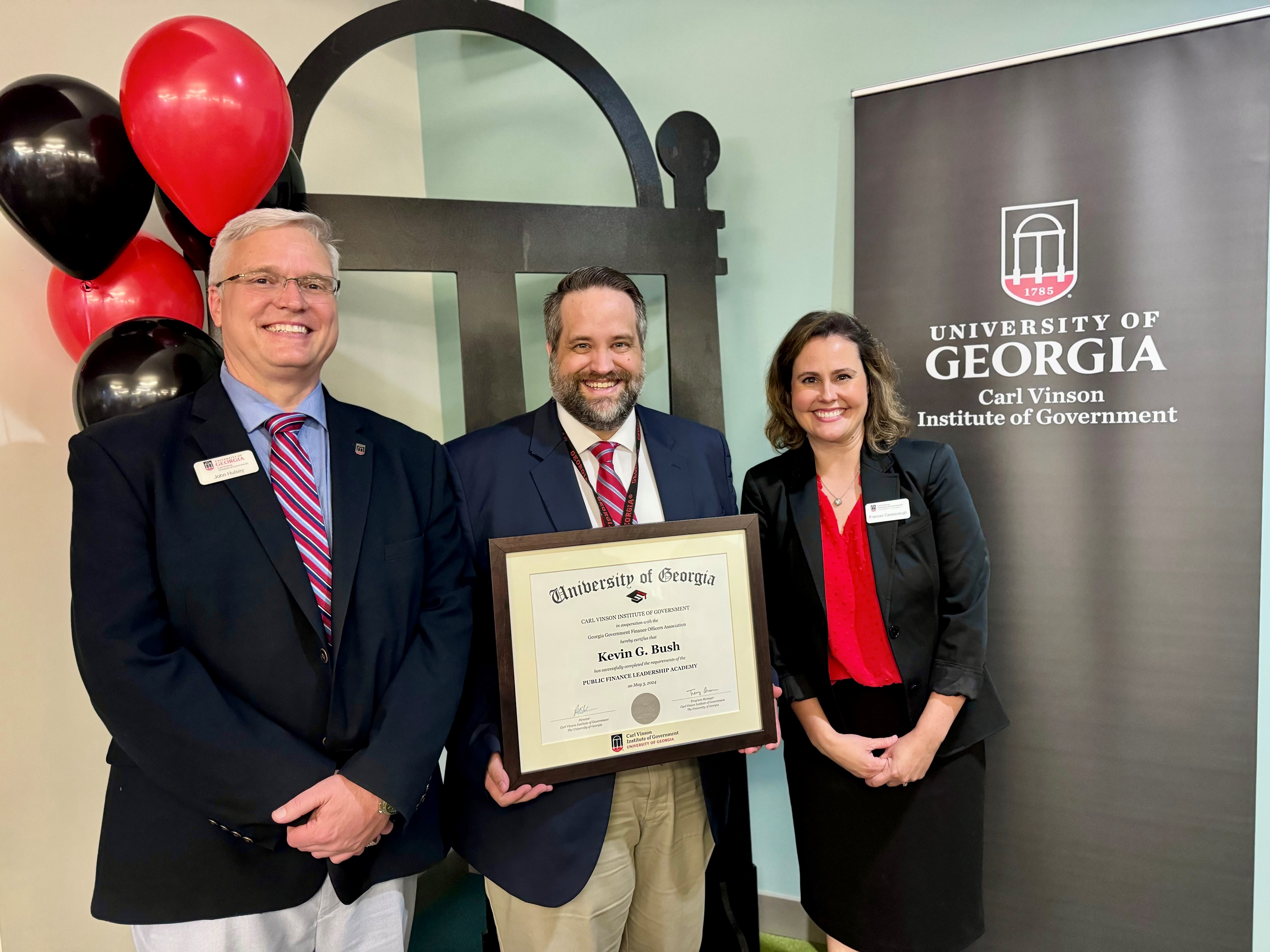 From left to right, UGA Institute of Government’s John Hulsey, City of Carrollton Finance Director Kevin Bush, and Institute of Government’s Frances Cassavaugh pose at the PFLA graduation ceremony. Photo courtesy of Kevin Bush.