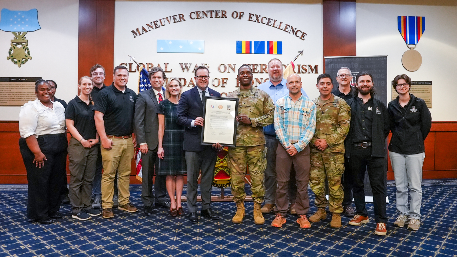 Representatives from the UGA Institute of Government and Fort Moore with the intergovernmental support agreement (IGSA) proclamation. The agreement is a cost-effective way for Fort Moore to acquire services from state or local governments while building stronger relationships with surrounding communities. 