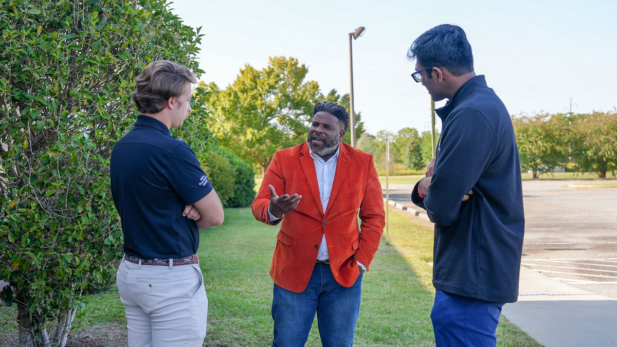 Central Georgia Technical College’s Marcus Early, center, speaks to PROPEL Rural Scholars Christian Dent, left, and Yash Sajjan, right, after an Archway executive committee meeting in Hawkinsville.