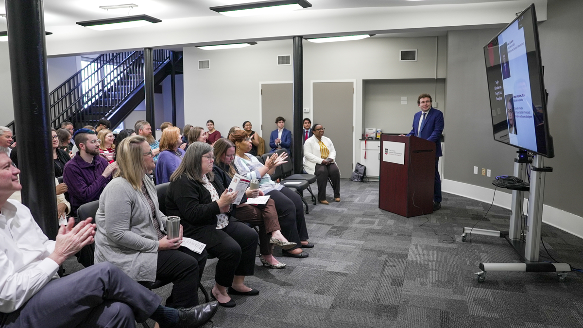 UGA student and Vinson Fellow Adam Brantley presents his research on the effects of age-based property tax exemptions on rural school districts at the UGA Institute of Government.