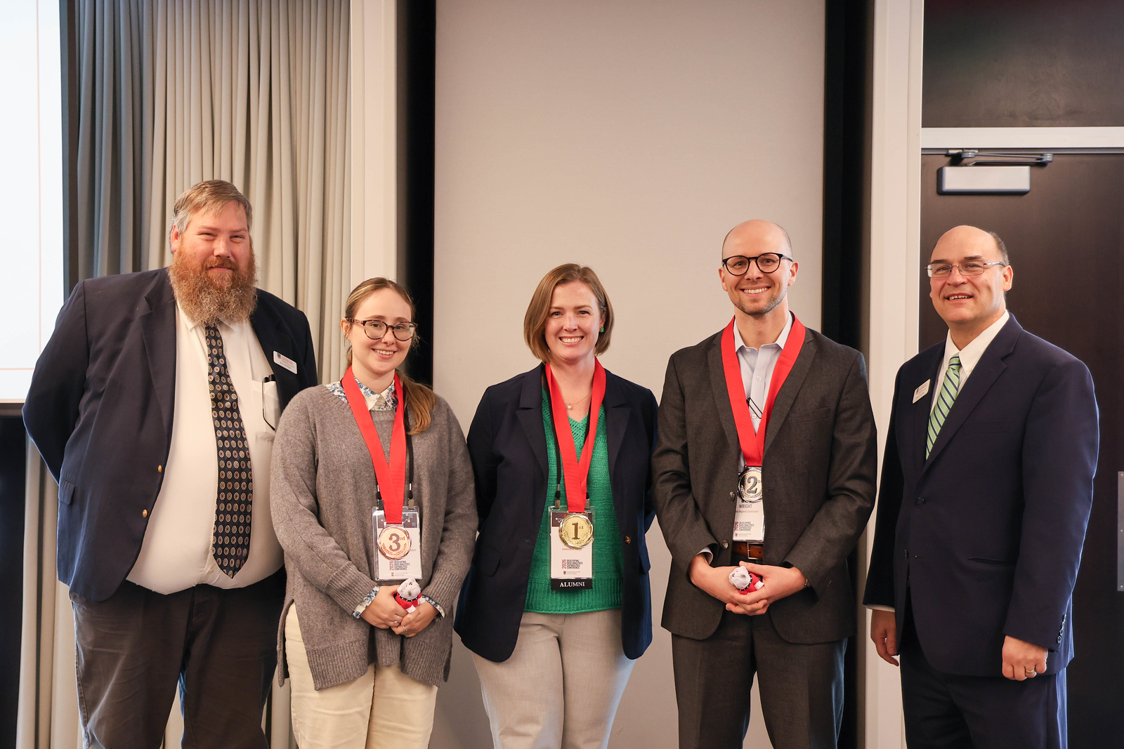 Gold, Silver and Bronze Data Olympics winners were recognized at the Developing Data Analytics and Capabilities Conference. From left to right, Eric McRae, associate director, Institute of Government; Kate Heidenreich, research analyst, Judicial Council of Georgia Administrative Office of the Courts’ Office of Research and Analysis; Savannah Hembree, business manager, UGA Office of Emergency Preparedness and Insurance and Claims Management; Will Wright, principal data scientist, Atlanta Regional Commission Research and Innovation; and David Tanner, associate director, Institute of Government. Photo by Cameron Pearce