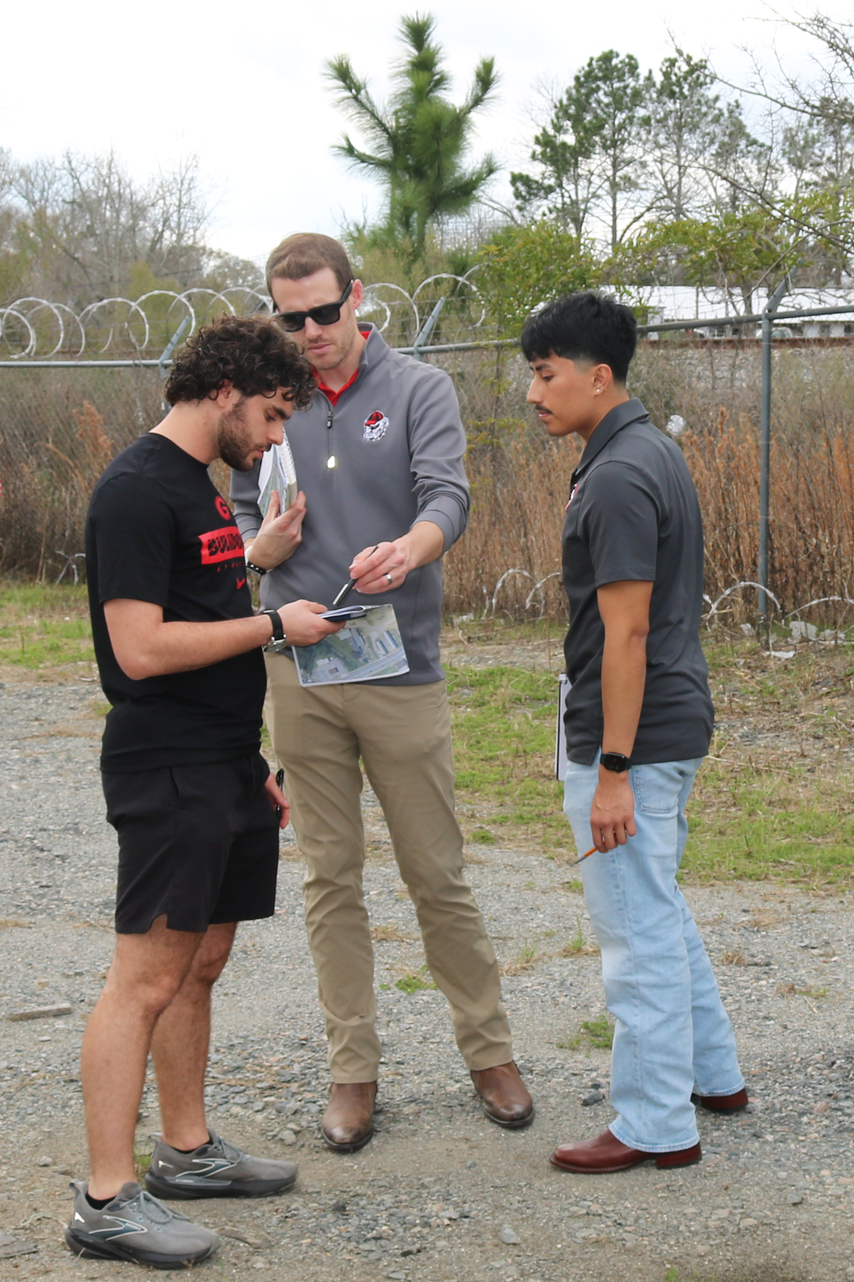 James Schulte, landscape architect lecturer in the UGA College of Environment and Design, with students Ethan Levine (left) and Jesse Gonzalez on a site visit to the Short & Paulk Supply Company in Tifton. Schulte says collaborating with the Institute of Government provides beneficial service-learning experiences for students: “It allows them to communicate with community stakeholders, and the opportunity to work outside the walls of our building on real projects, so that when they enter internships or entry-level positions, they have better knowledge of how projects run in the real world.”