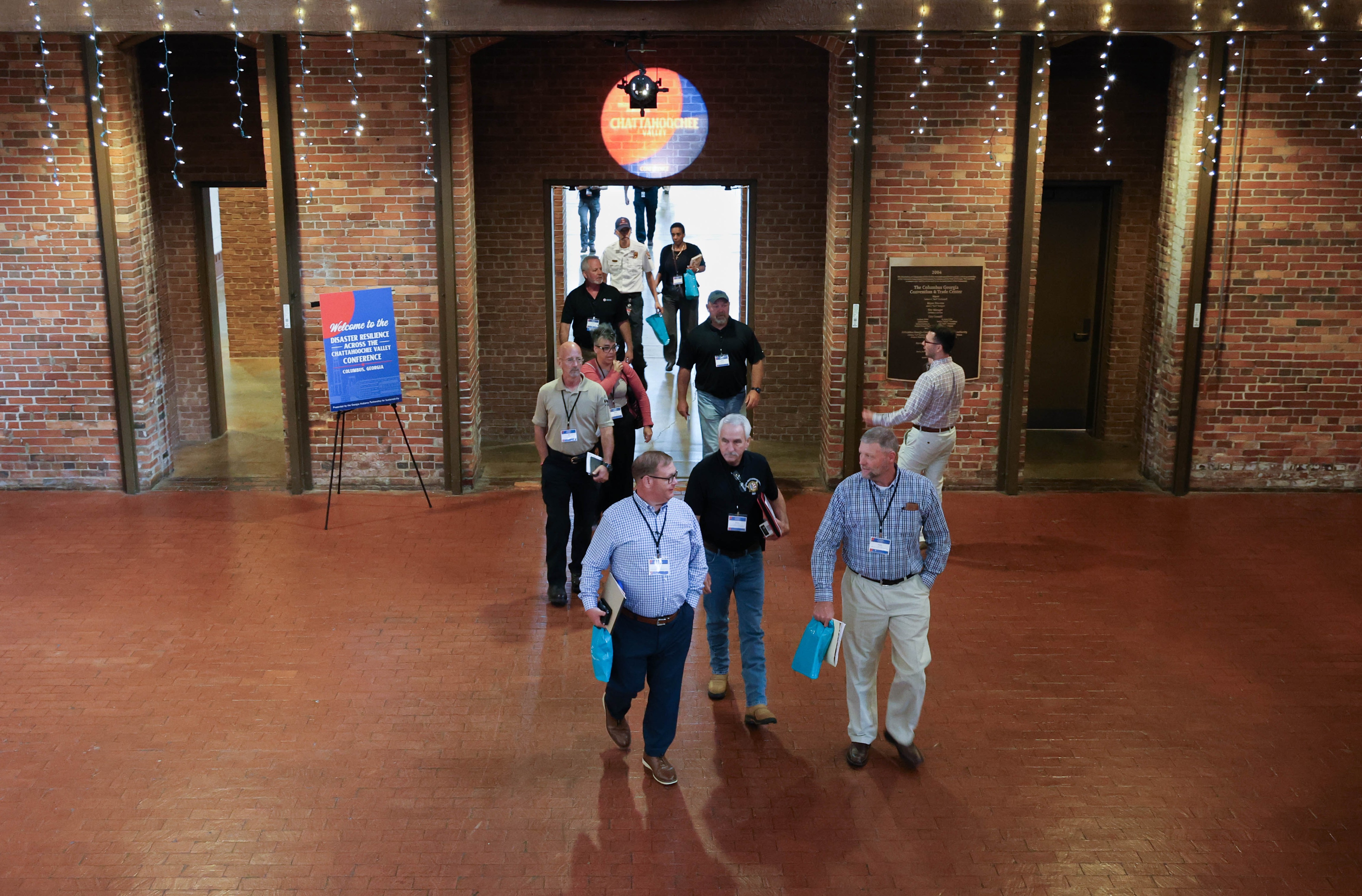 People enter the Disaster Resilience Across the Chattahoochee River Valley Conference at the Columbus Georgia Convention and Trade Center.
