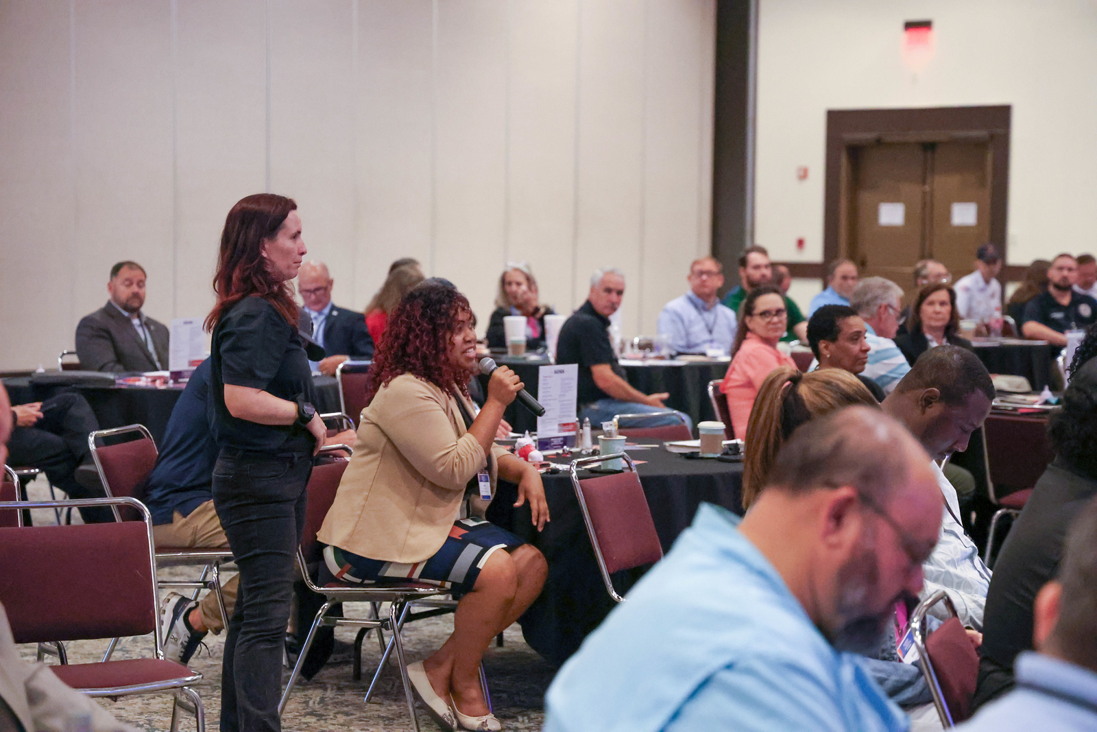 Jerica McCrary of Valley Healthcare System asks a question during a plenary session.