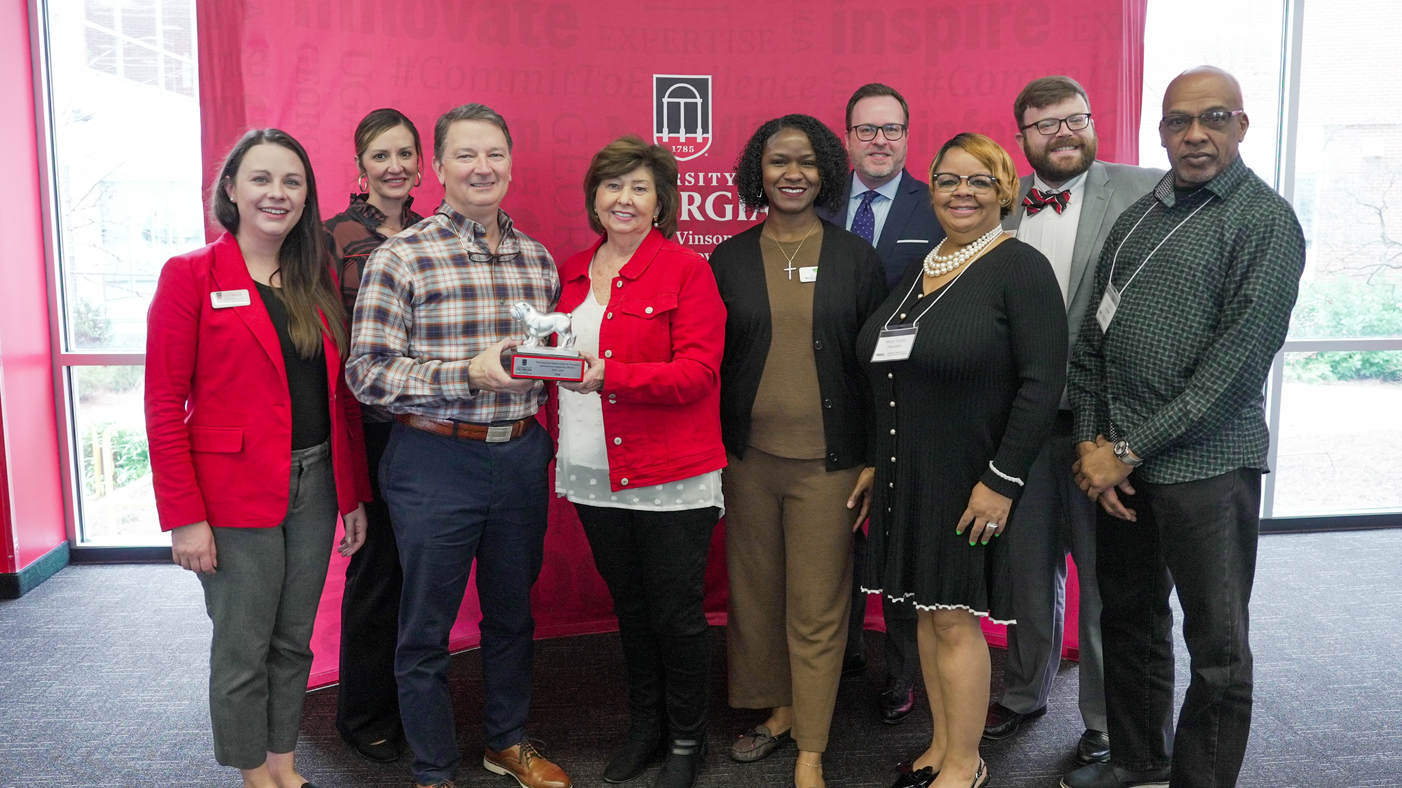 Crisp County was recognized for completing the PROPEL program. Left to right, Rebecca Hunt (Institute of Government), Kameron Causey (PROPEL community team), Tim Powers (PROPEL community team), Monica Simmons (PROPEL community team), Monica Robinson (PROPEL community team), Rob Gordon (Institute of Government), Mary Darby (PROPEL community team), Greg Wilson (Institute of Government) and Maurice Hill (PROPEL community team). (Photo by Sara Ingram, UGA)