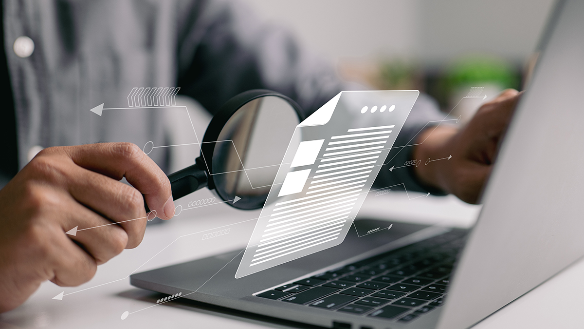 Case studies illustration of a person holding a magnifying glass in front of a computer.